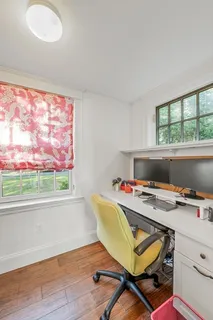 a workspace with furniture and a window