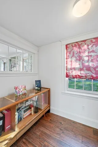 a bedroom with furniture and a window