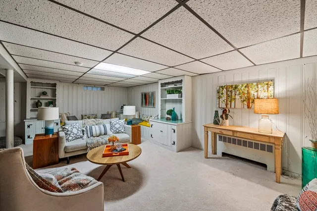 a living room with furniture and a table