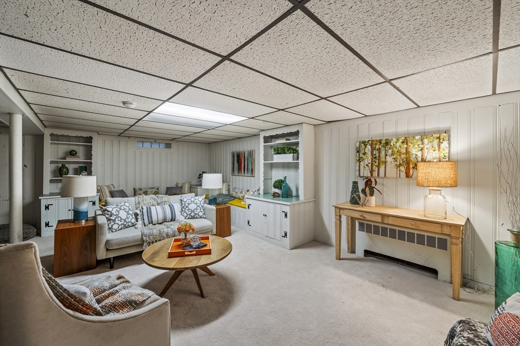 19 Elmwood Road Marblehead, MA 01945 - Photo 17 of 36 a living room with furniture and a table