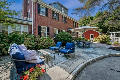 a front view of house with outdoor seating