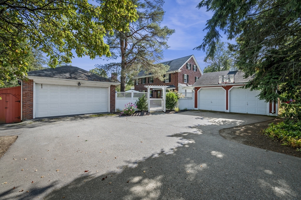 19 Elmwood Road Marblehead, MA 01945 - Photo 32 of 36 a front view of a house with a yard and garage