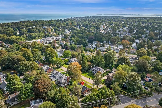 an aerial view of multiple house with yard