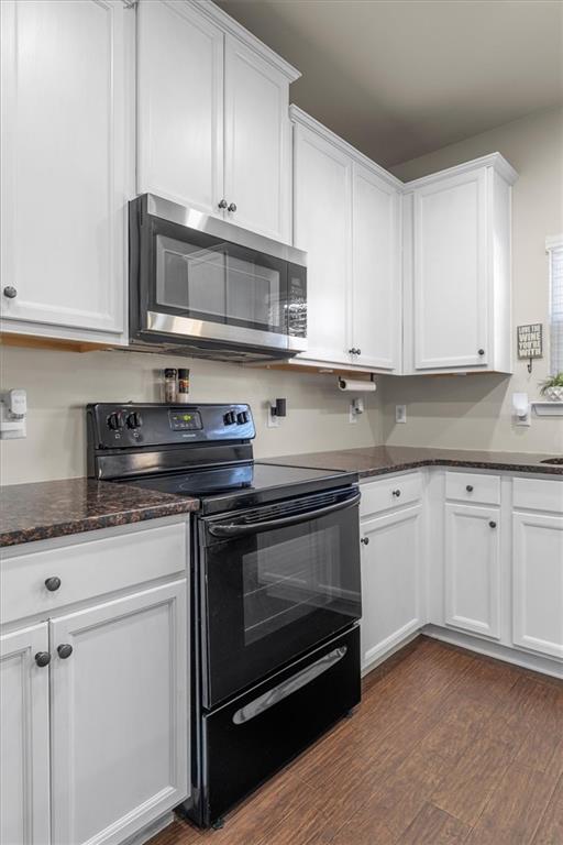 329 Rippling Drive Ball Ground, GA 30107 - Photo 17 of 43 a kitchen with stainless steel appliances granite countertop a stove a sink and a microwave