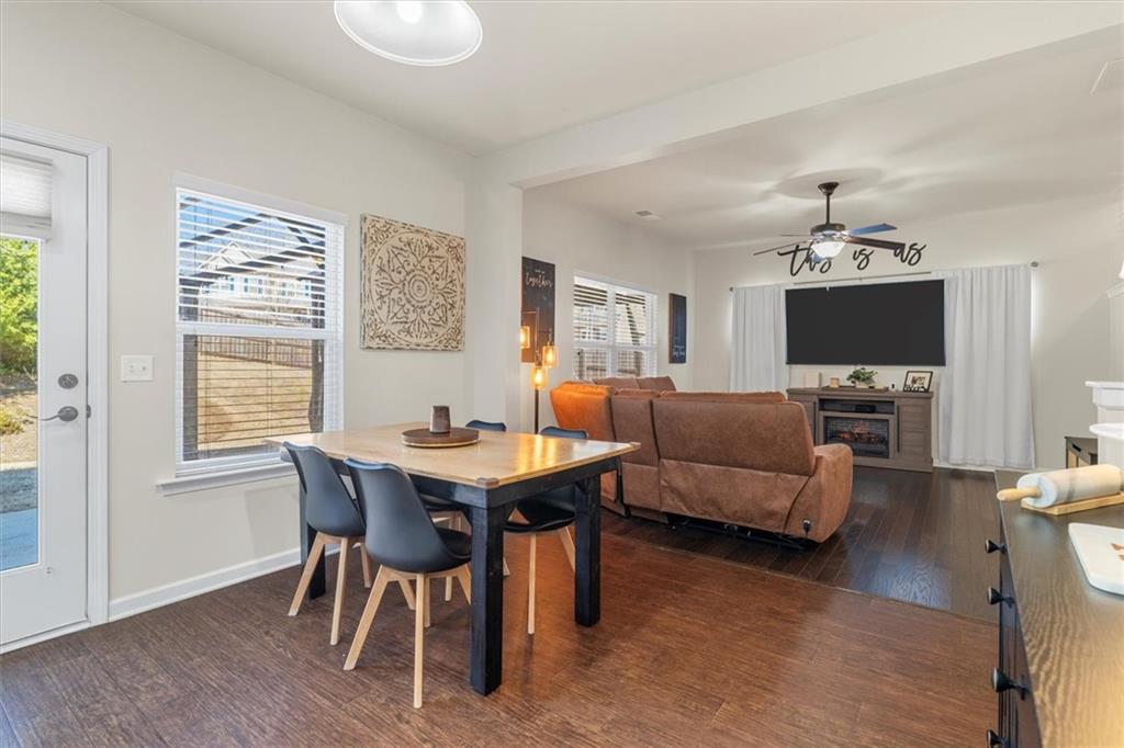 329 Rippling Drive Ball Ground, GA 30107 - Photo 18 of 43 a view of a dining room with furniture window and wooden floor
