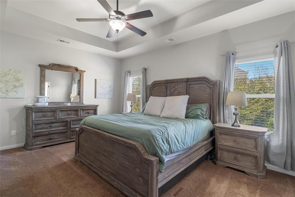 329 Rippling Drive Ball Ground, GA 30107 - Photo 24 of 43 a bedroom with a bed and a dresser