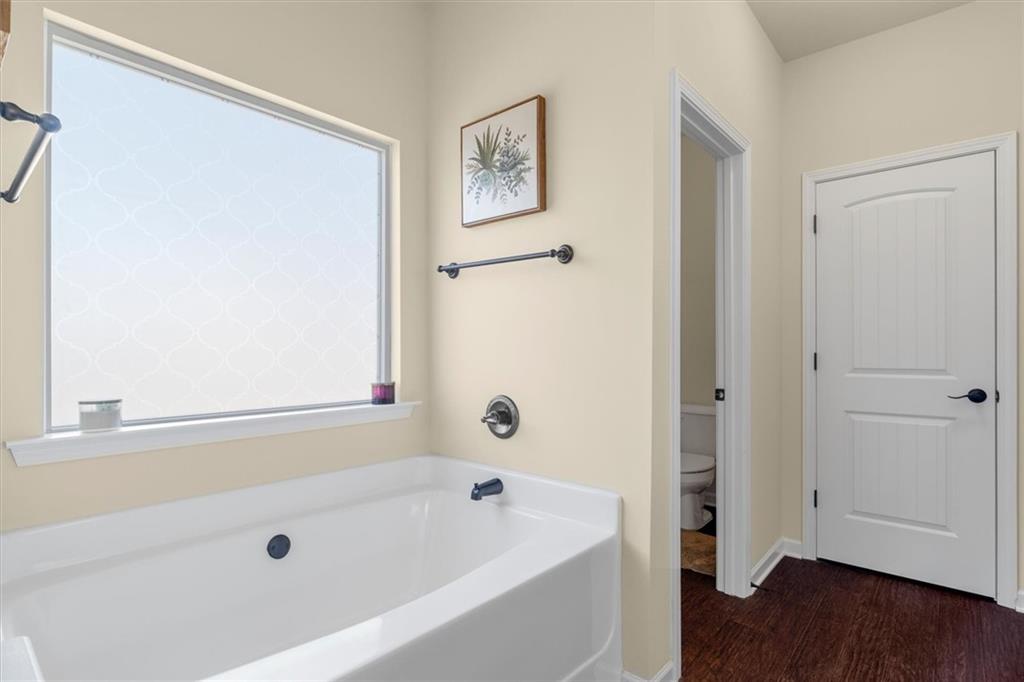 329 Rippling Drive Ball Ground, GA 30107 - Photo 27 of 43 a bathroom with a tub and shower