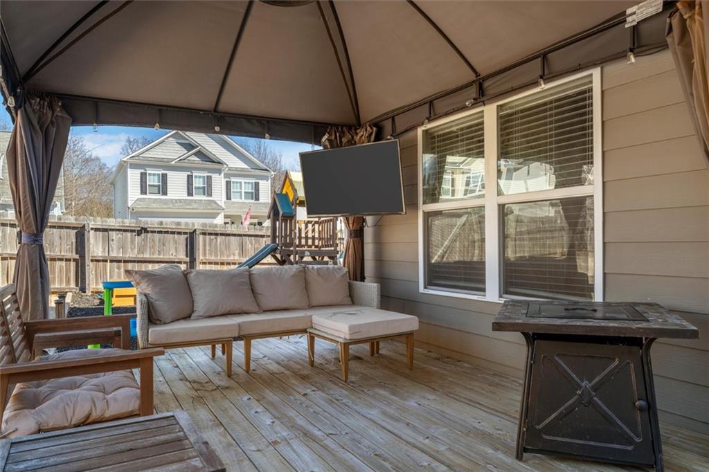 329 Rippling Drive Ball Ground, GA 30107 - Photo 31 of 43 a view of living room with couch and a table