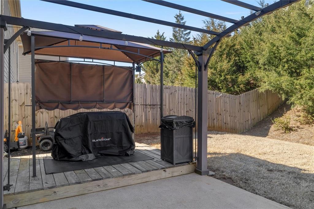 329 Rippling Drive Ball Ground, GA 30107 - Photo 32 of 43 a view of a door and a car parked in the road