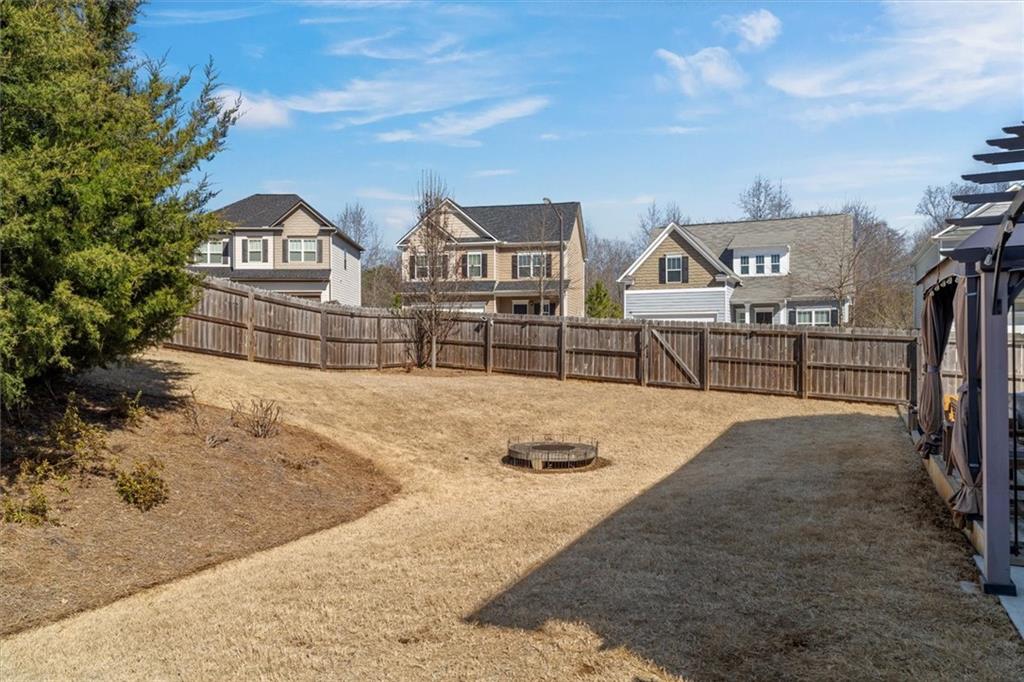 329 Rippling Drive Ball Ground, GA 30107 - Photo 33 of 43 a view of a house with wooden fence
