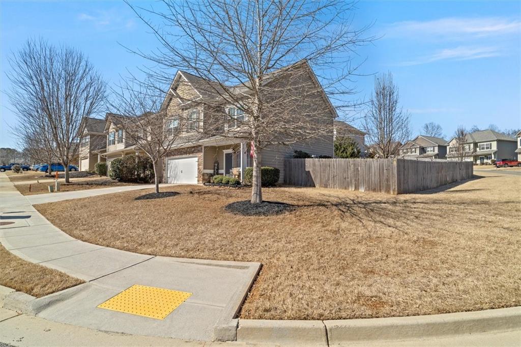 329 Rippling Drive Ball Ground, GA 30107 - Photo 4 of 43 a view of a house with snow on the road