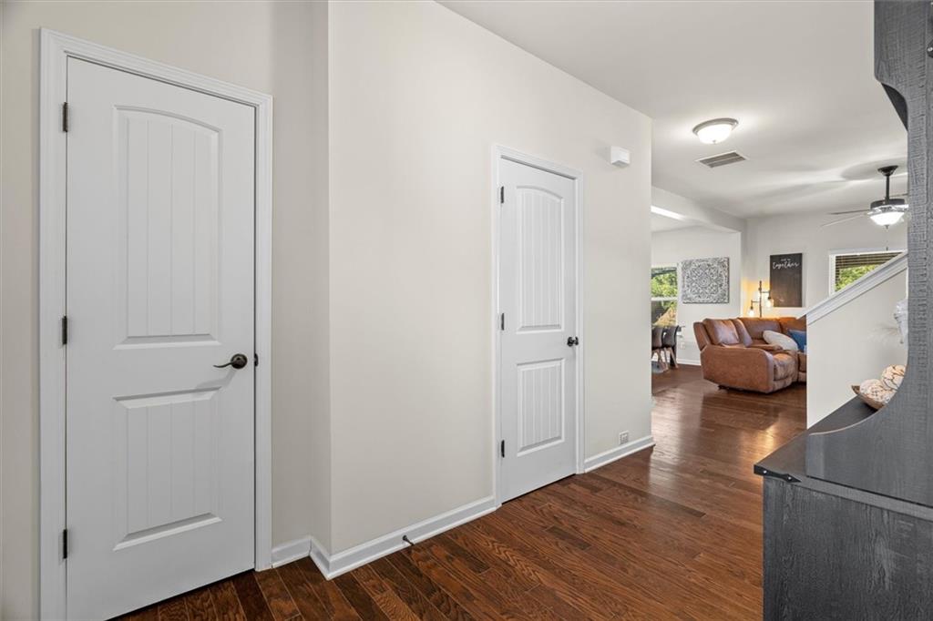 329 Rippling Drive Ball Ground, GA 30107 - Photo 6 of 43 a bedroom with furniture and a wooden floor
