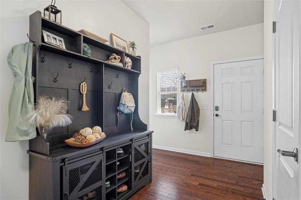 329 Rippling Drive Ball Ground, GA 30107 - Photo 7 of 43 a kitchen with stainless steel appliances a stove and cabinets