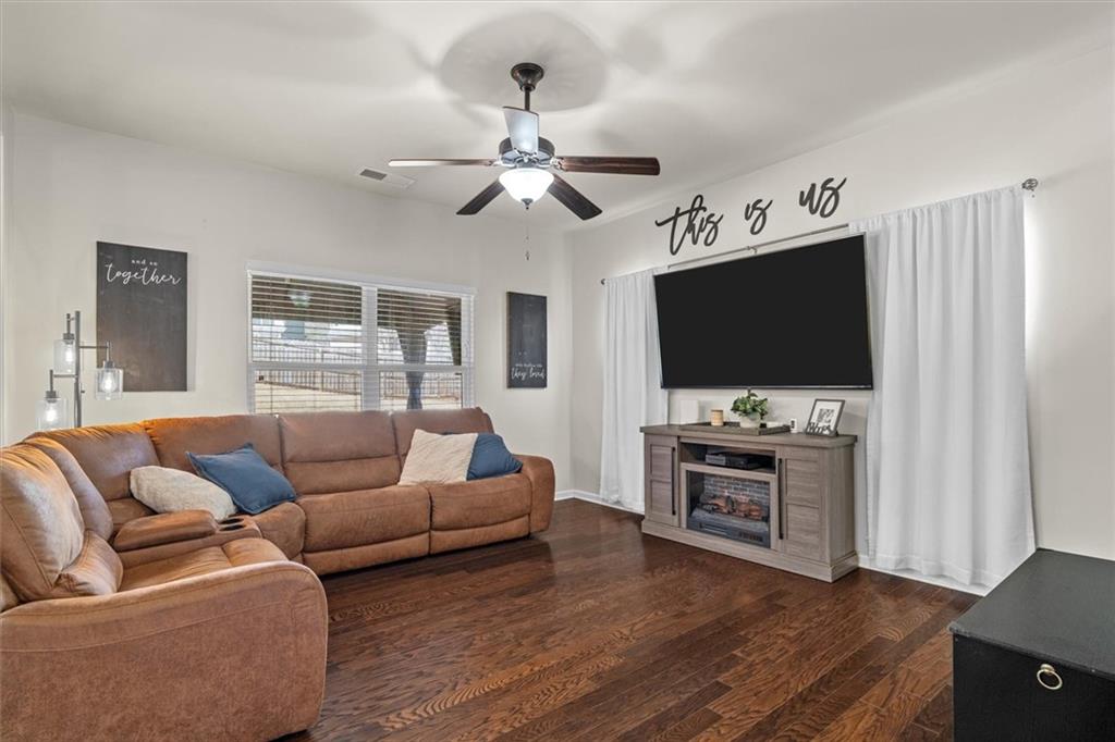 329 Rippling Drive Ball Ground, GA 30107 - Photo 8 of 43 a living room with furniture and a flat screen tv