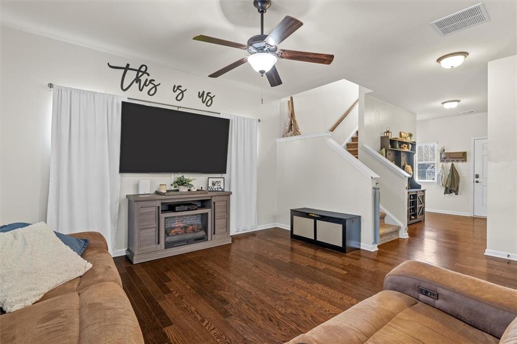 329 Rippling Drive Ball Ground, GA 30107 - Photo 9 of 43 a living room with furniture and a flat screen tv