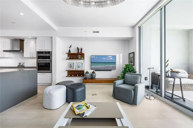 a bedroom with a bed and painting on the wall