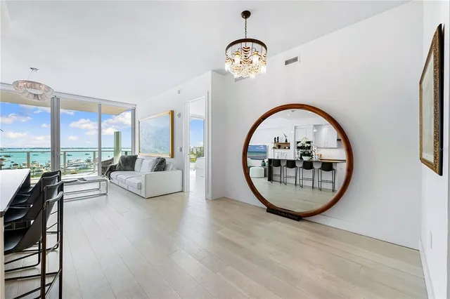 a spacious bedroom with a bed a couch and a window