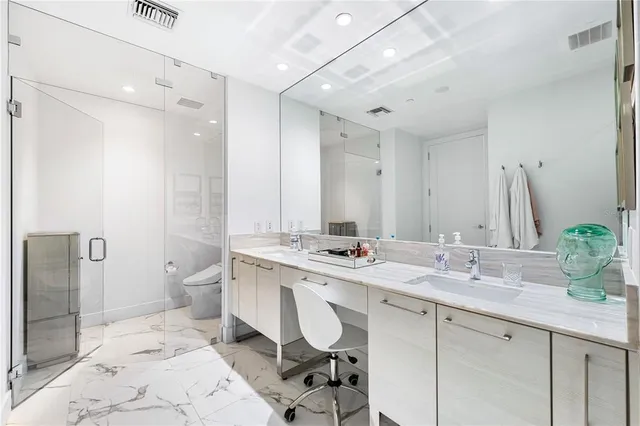 a utility room with sink dryer and washer
