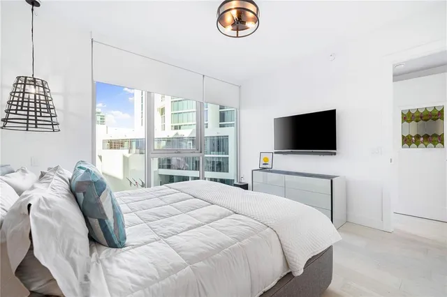 a balcony view with a couch and chandelier