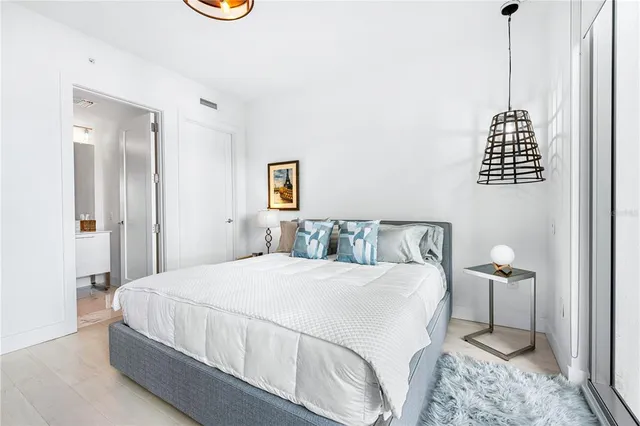a living room with furniture a rug and white walls