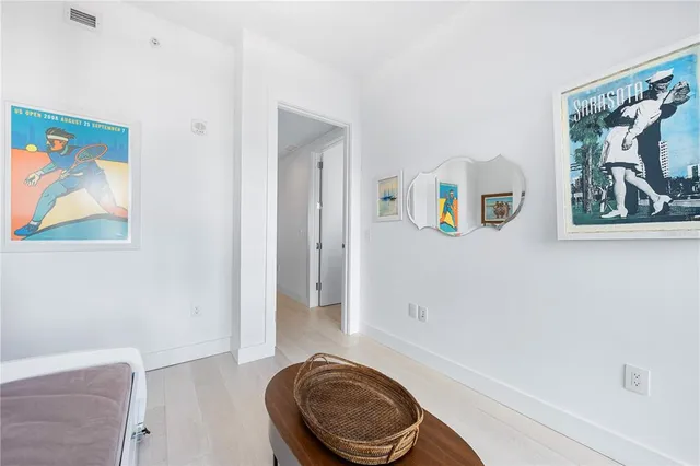 a view of a swimming pool with a patio and plants