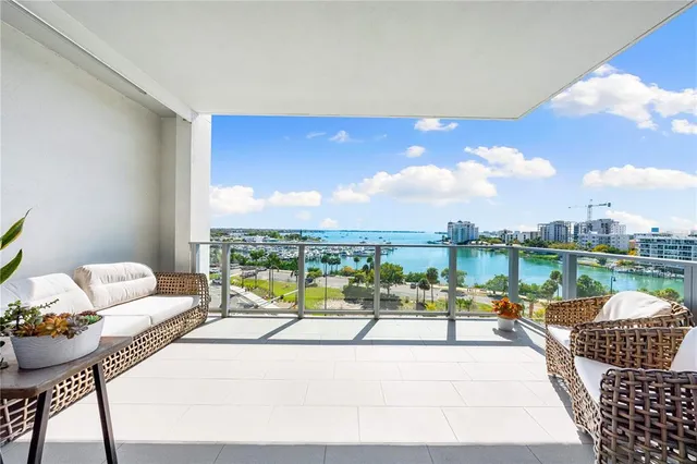 a living room with furniture fireplace and outdoor view