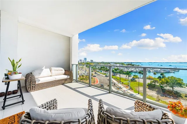 a view of a dining room with furniture and a potted plant