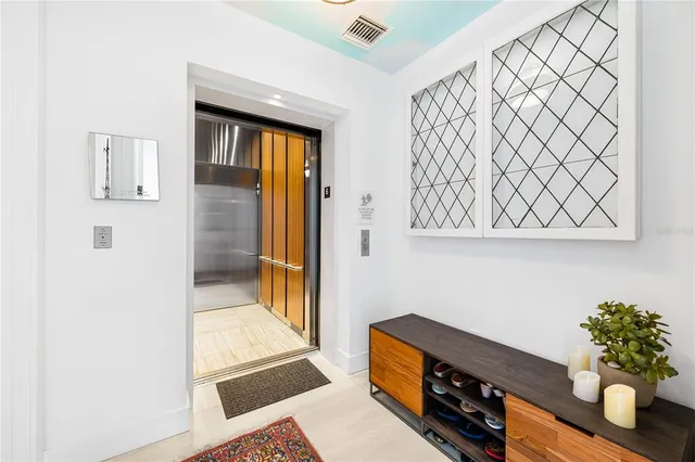 a kitchen with stainless steel appliances granite countertop a sink a stove and cabinets