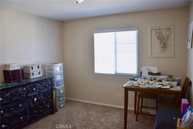 a view of a workspace with furniture