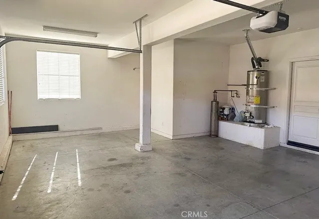 a view of a room with gym equipment and a window