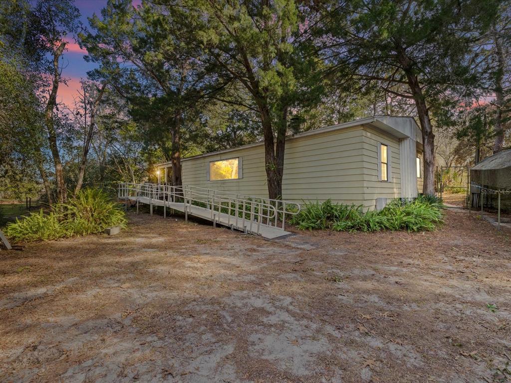 a backyard of a house with lots of green space