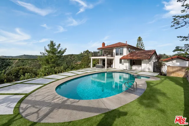 a view of a house with swimming pool