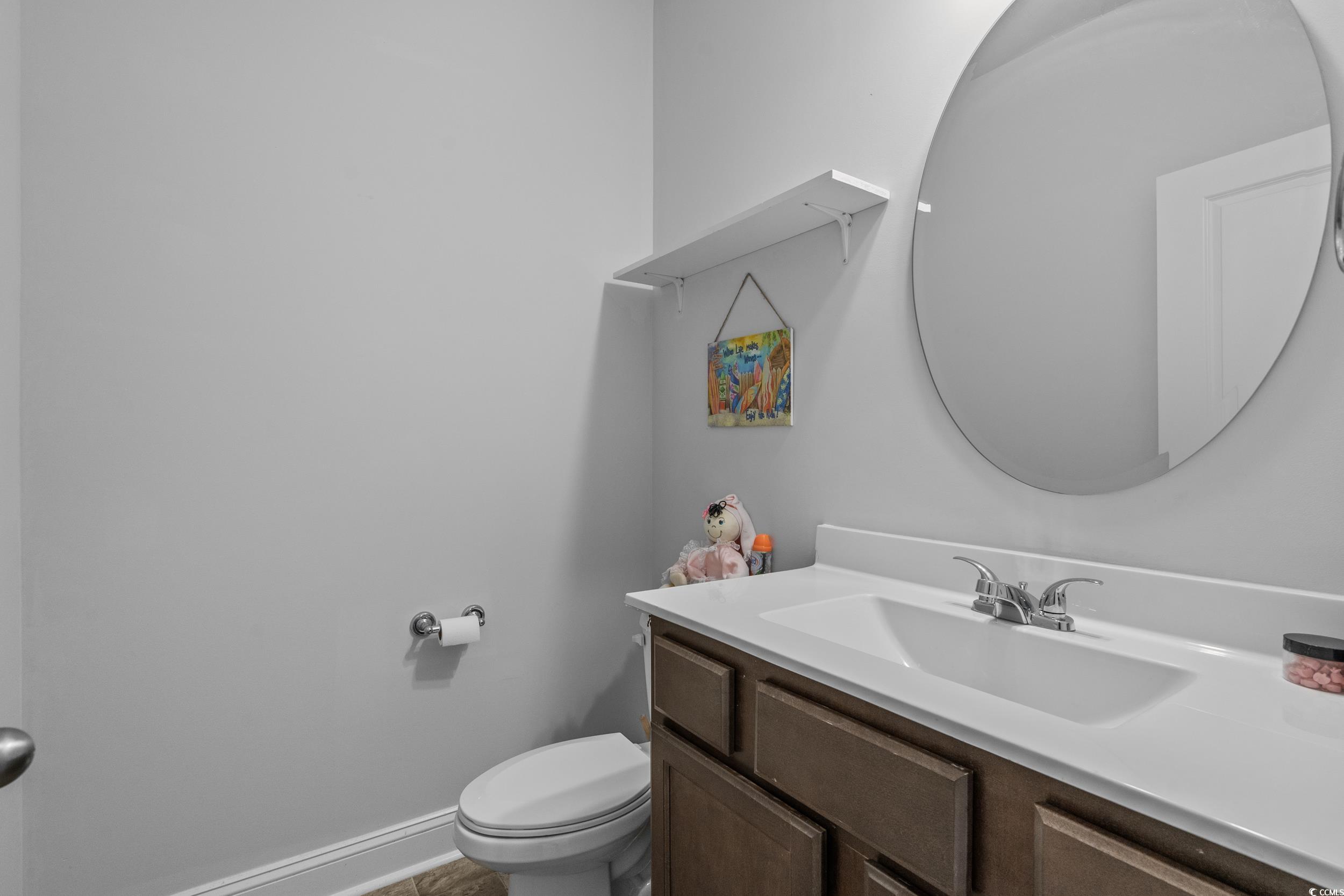 2064 Hazlette Loop Conway, SC 29526 - Photo 19 of 39 Half bathroom with baseboards, toilet, and vanity