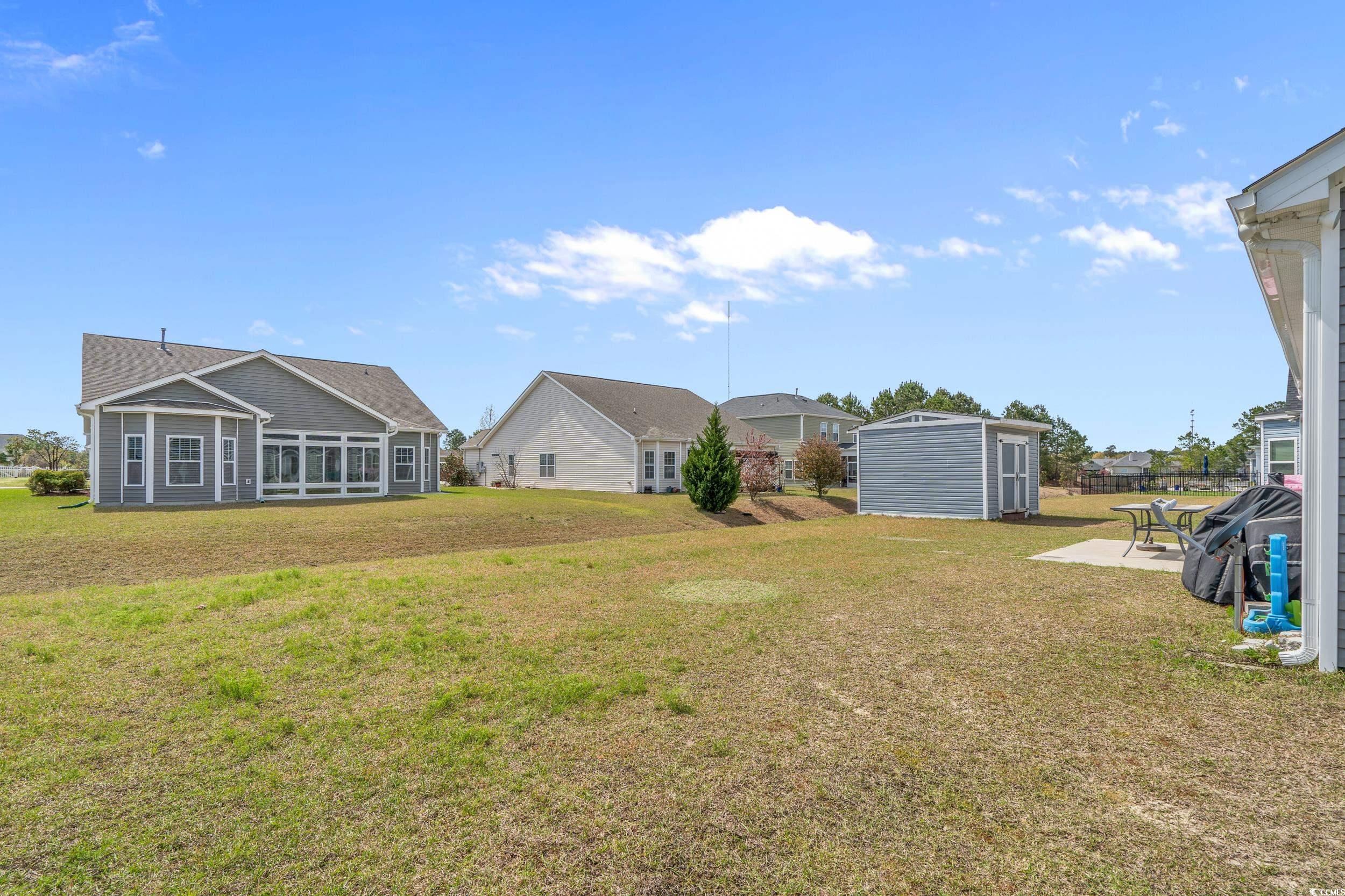 2064 Hazlette Loop Conway, SC 29526 - Photo 21 of 39 View of yard with a storage unit and an outdoor structure