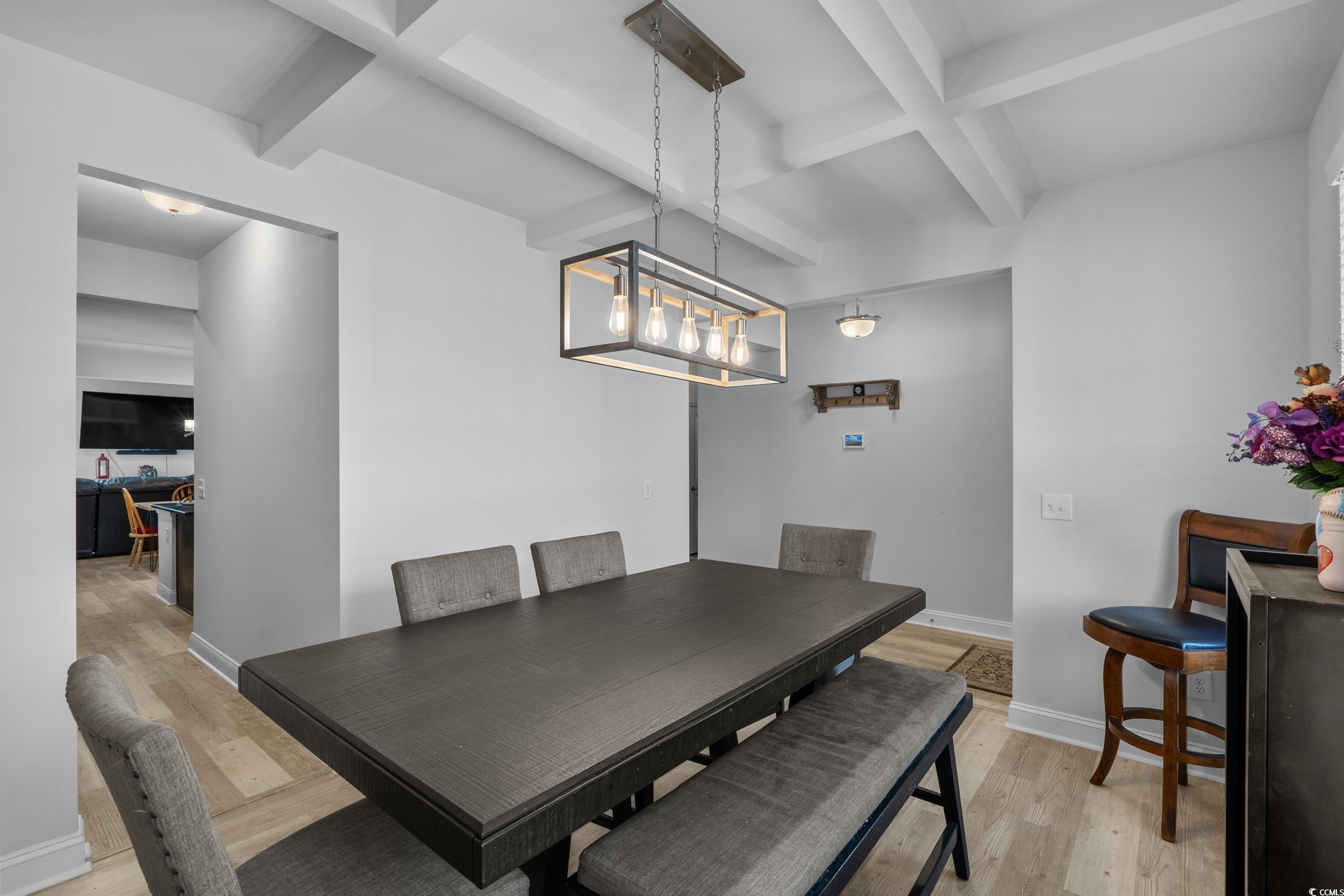 2064 Hazlette Loop Conway, SC 29526 - Photo 8 of 39 Dining room featuring baseboards, light wood-style flooring, coffered ceiling, and beamed ceiling