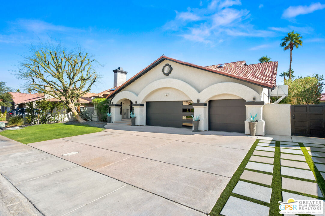 28220 Horizon Road Cathedral City, CA 92234 - Photo 11 of 40 a front view of a house with a yard