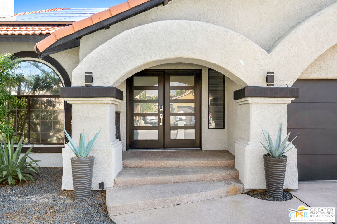 28220 Horizon Road Cathedral City, CA 92234 - Photo 12 of 40 a front view of a house with garden