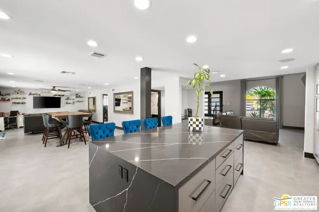 an open kitchen view with table and chairs