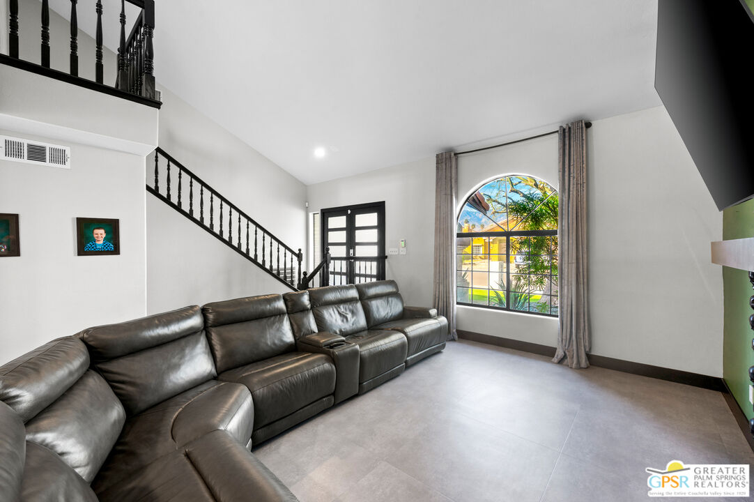 28220 Horizon Road Cathedral City, CA 92234 - Photo 15 of 40 a living room with furniture and a gate