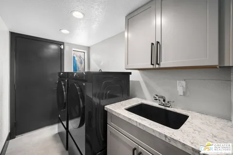 a kitchen with a sink and cabinets