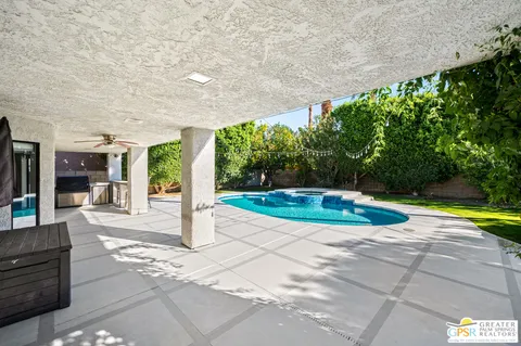 a view of a swimming pool with a patio