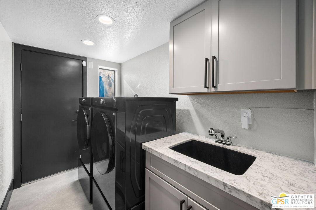 28220 Horizon Road Cathedral City, CA 92234 - Photo 20 of 40 a kitchen with a sink and cabinets