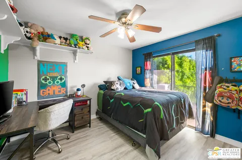 a bedroom with a bed and a table in it