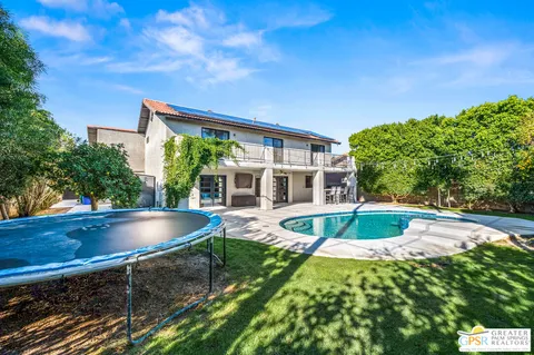 a view of a swimming pool with a patio