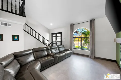 a living room with furniture and a gate