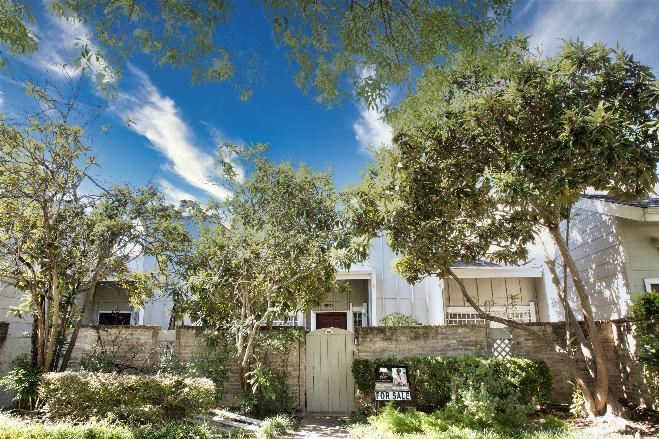 13005 Leader Street, Unit 563 Houston, TX 77072 - Photo 1 of 18 front view of a house with a yard
