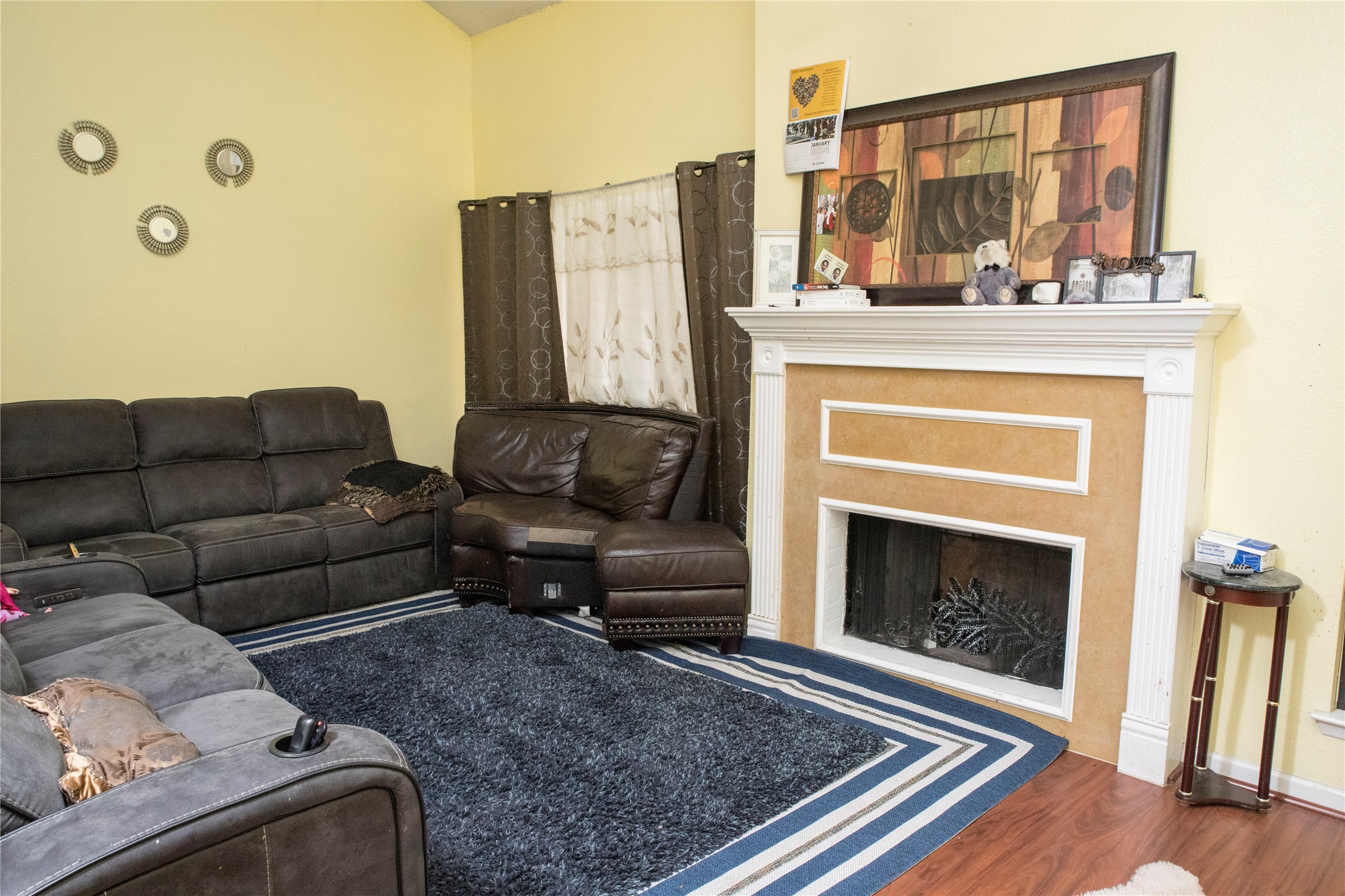 13005 Leader Street, Unit 563 Houston, TX 77072 - Photo 3 of 18 a living room with furniture or couch and a fireplace