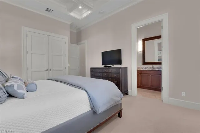 a bedroom with a bed and a television