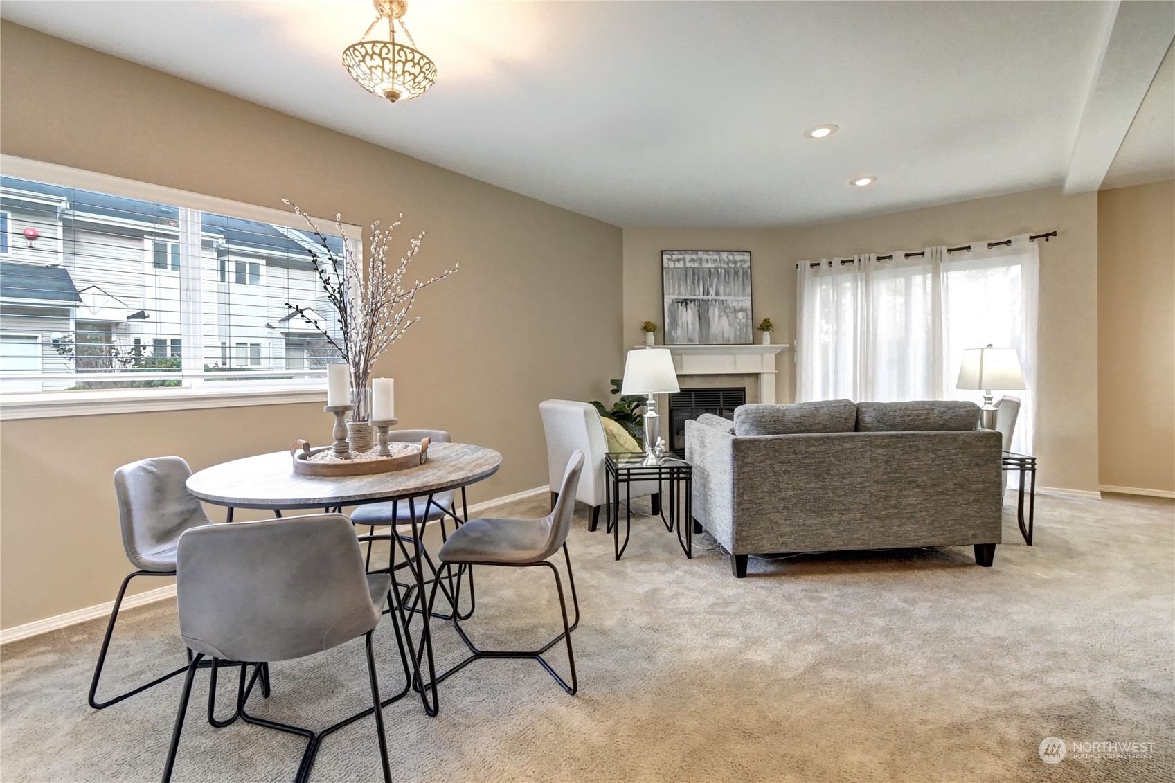 459 Queen Avenue Northeast, Unit 304 Renton, WA 98056 - Photo 8 of 21 a living room with furniture and a table