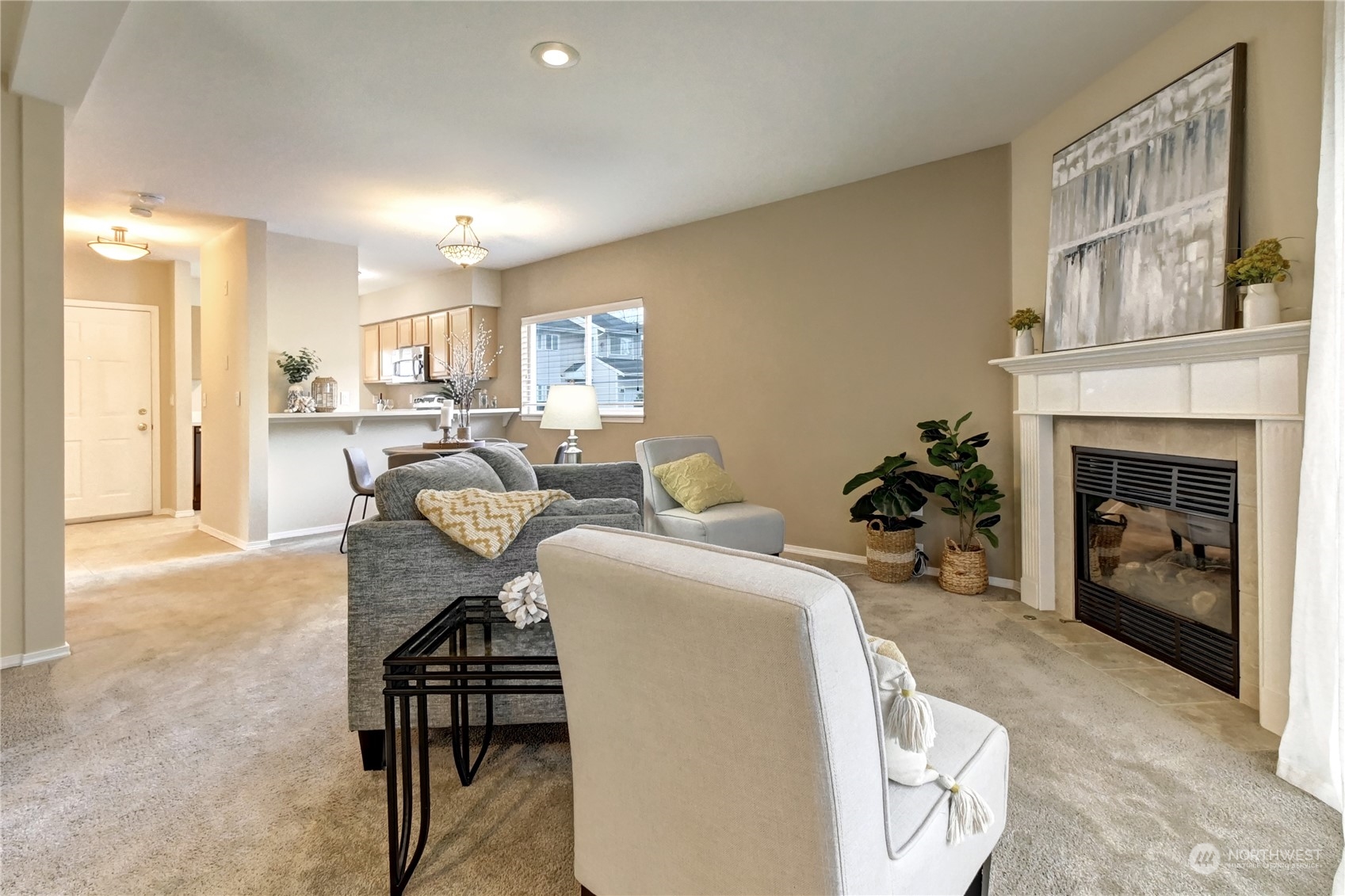 459 Queen Avenue Northeast, Unit 304 Renton, WA 98056 - Photo 9 of 21 a living room with furniture a fireplace and a large window